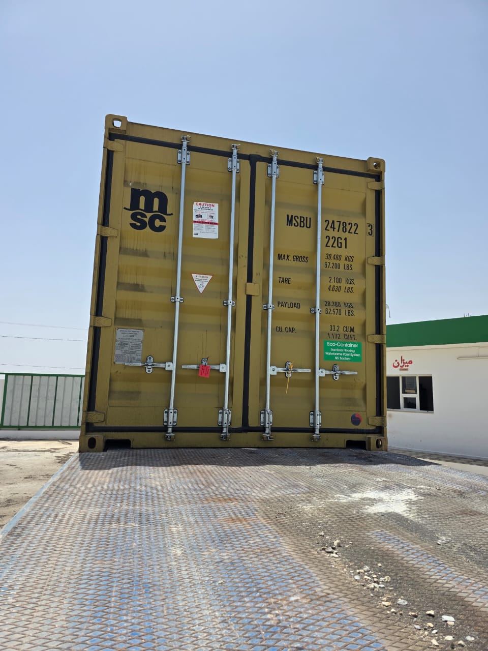 Closed maritime container with a visible security seal after flexitank preparation