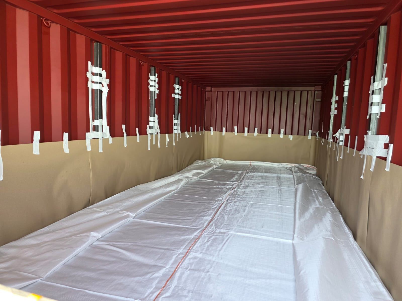 Flexitank installed inside a lined maritime shipping container