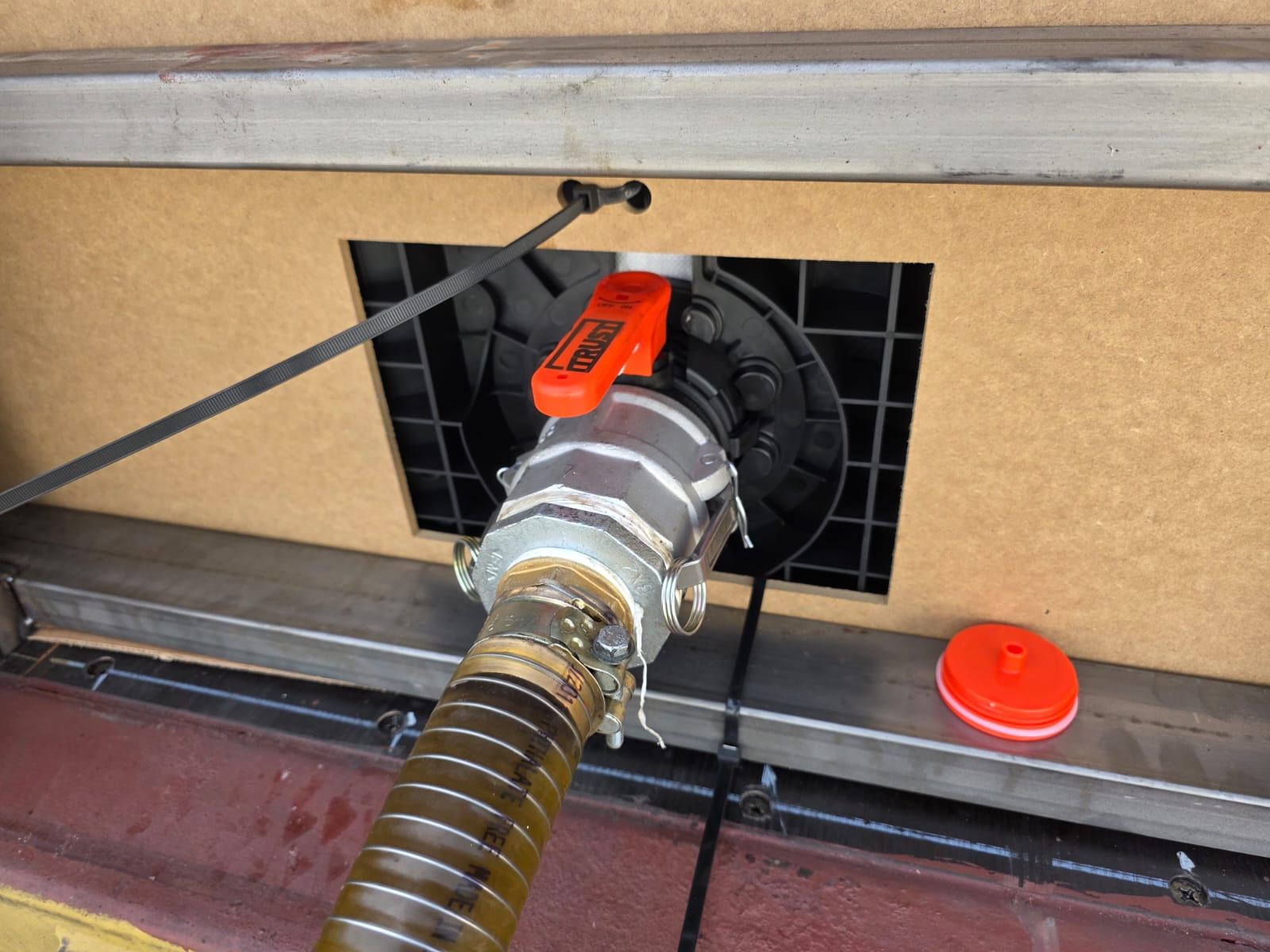 Hose connected to the photographed flexitank outlet valve assembly